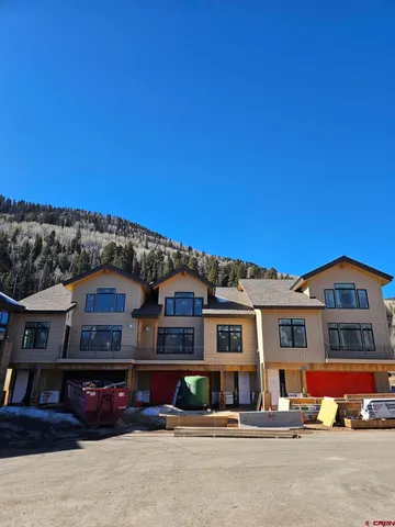 a view of a large building with large windows and a fireplace