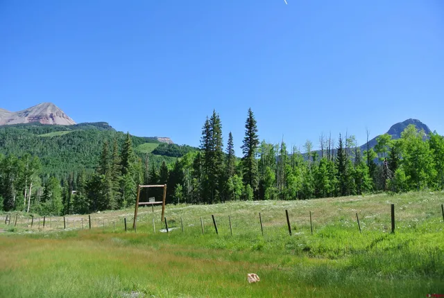 a view of a street with a building in the background