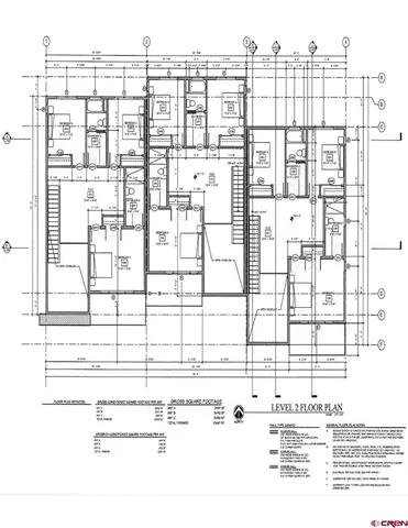 a view of a big house with wooden floor and a fireplace