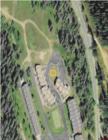 a front view of a house with cars parked