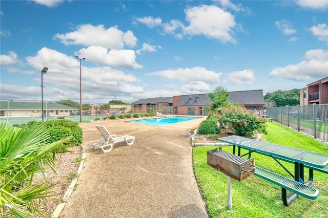 a view of a swimming pool with a porch