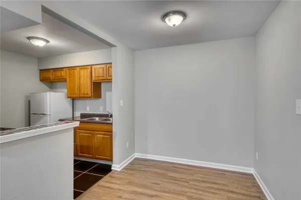 a view of a kitchen with a sink and a microwave