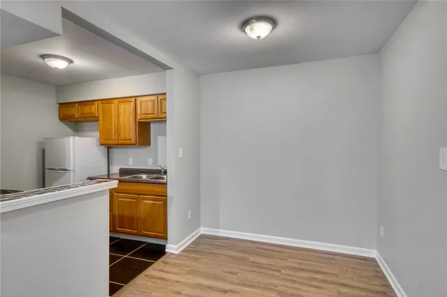 a view of a kitchen with a sink and a microwave