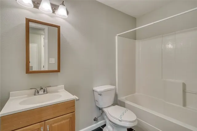 a bathroom with a toilet a sink and a bathtub