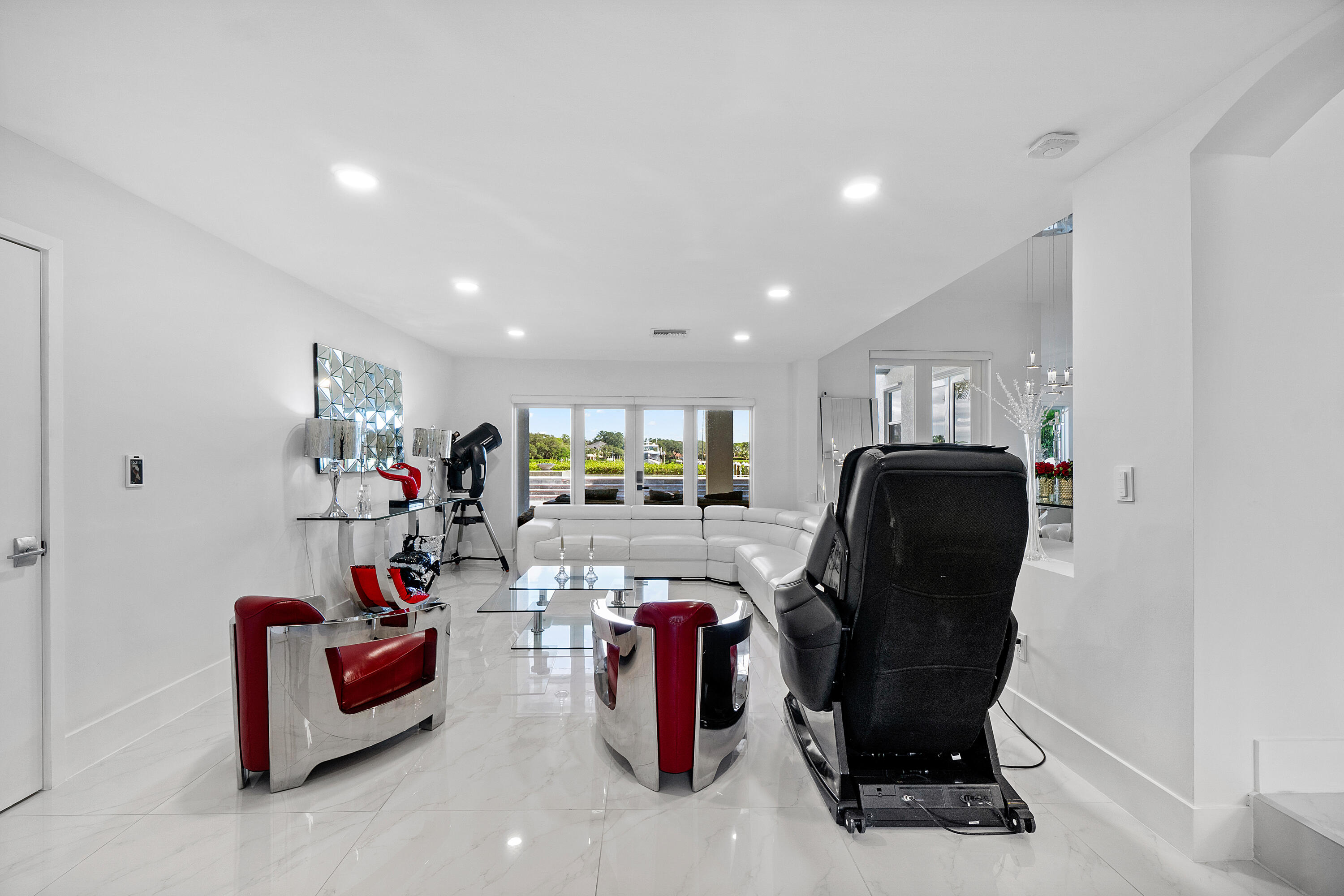 5447 Center Street Jupiter, FL 33458 - Photo 8 of 60 a view of a livingroom with furniture and a potted plant