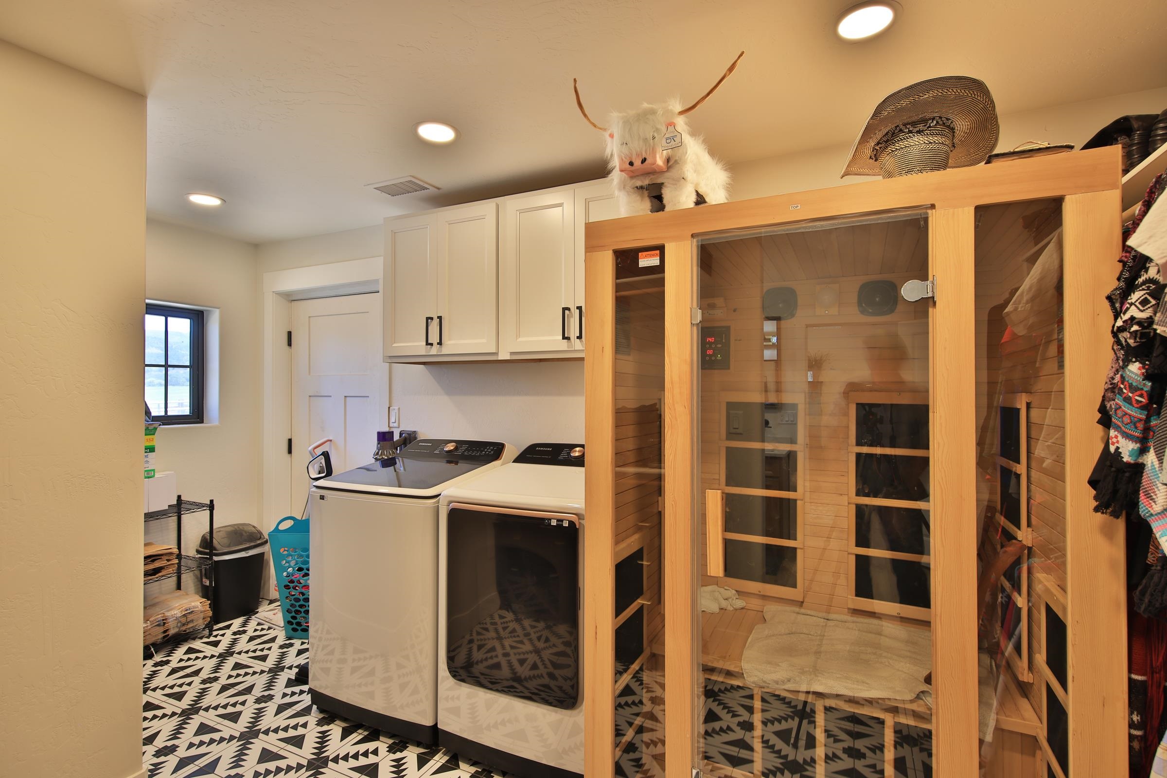 58749 Oe Road Collbran, CO 81624 - Photo 18 of 42 a kitchen with stainless steel appliances granite countertop a refrigerator a stove and a sink with wooden floor