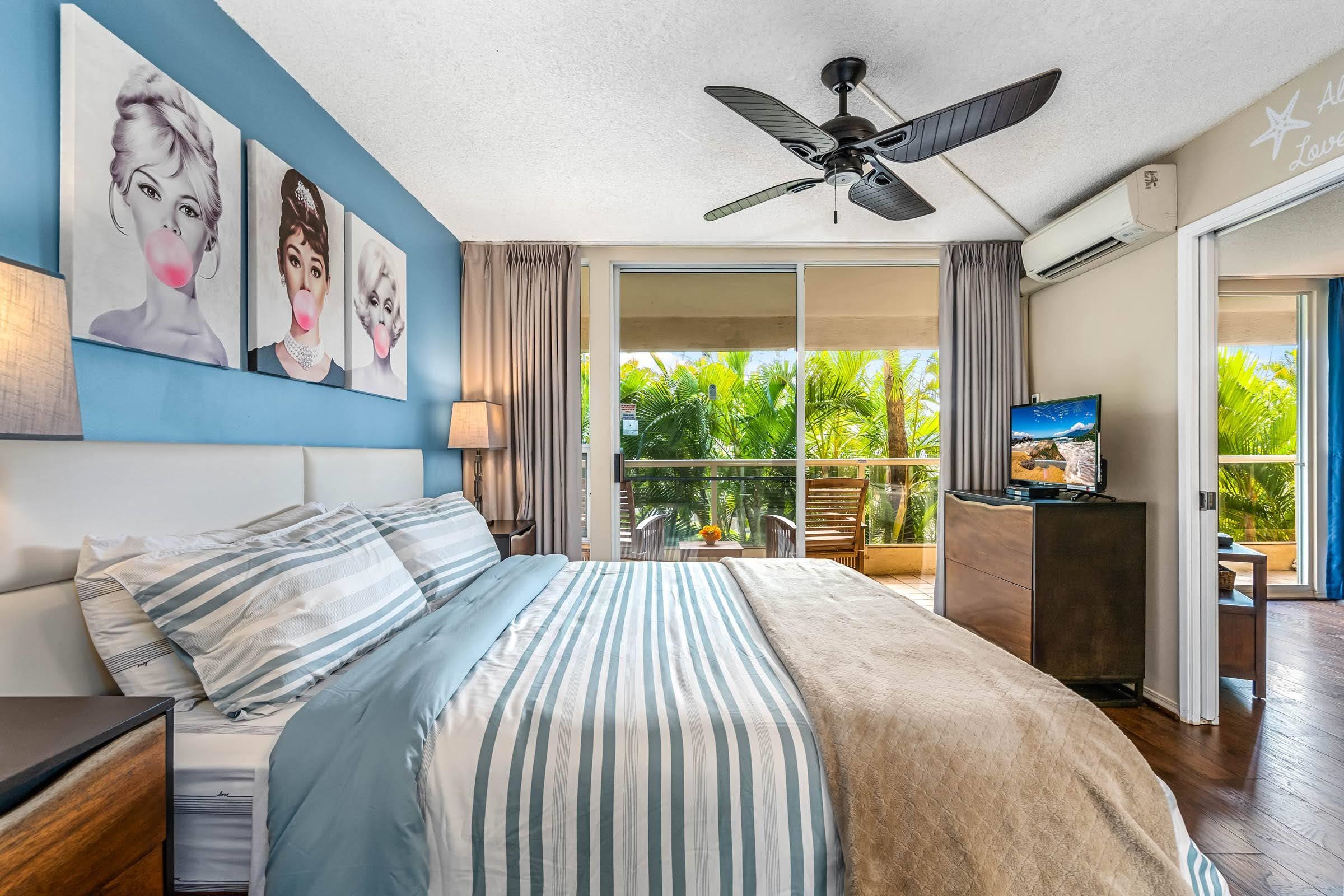 2575 South Kihei Road, Unit G209 Kihei, HI 96753 - Photo 11 of 27 a bedroom with a large bed and a large window