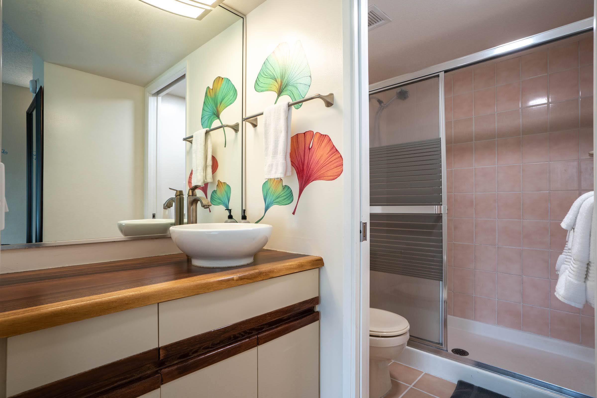 2575 South Kihei Road, Unit G209 Kihei, HI 96753 - Photo 23 of 27 a bathroom with a granite countertop sink a toilet and shower