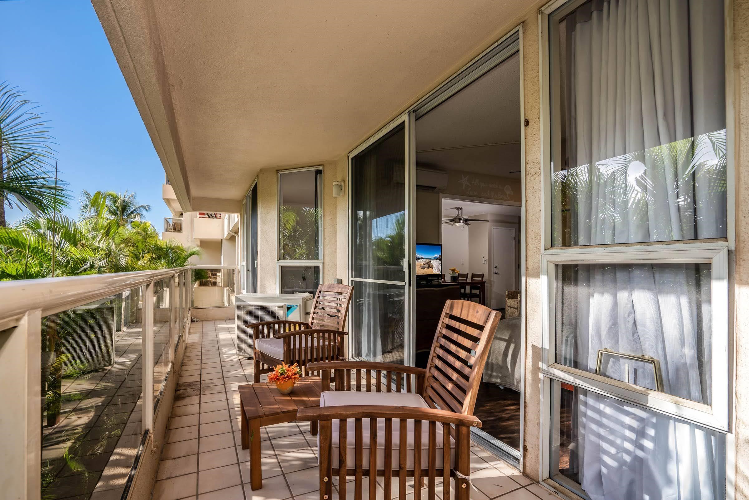 2575 South Kihei Road, Unit G209 Kihei, HI 96753 - Photo 25 of 27 a view of an chair and tables in the balcony