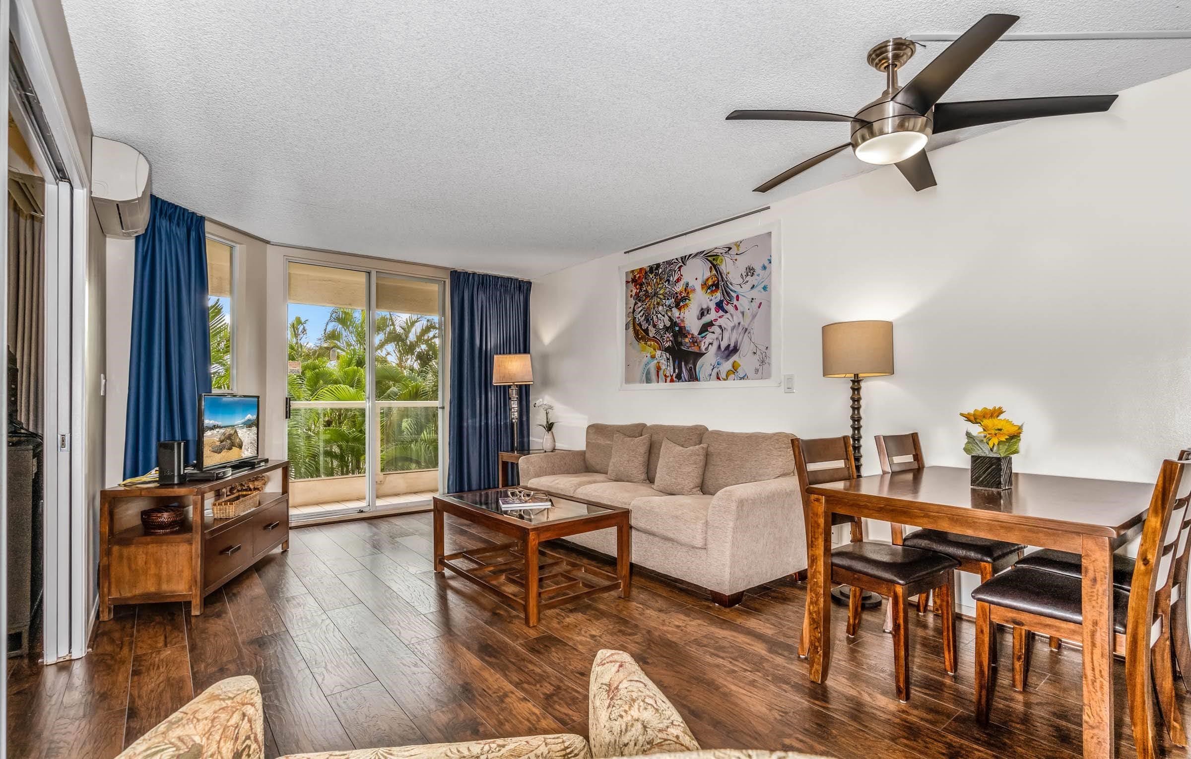 2575 South Kihei Road, Unit G209 Kihei, HI 96753 - Photo 5 of 27 a living room with furniture and a large window