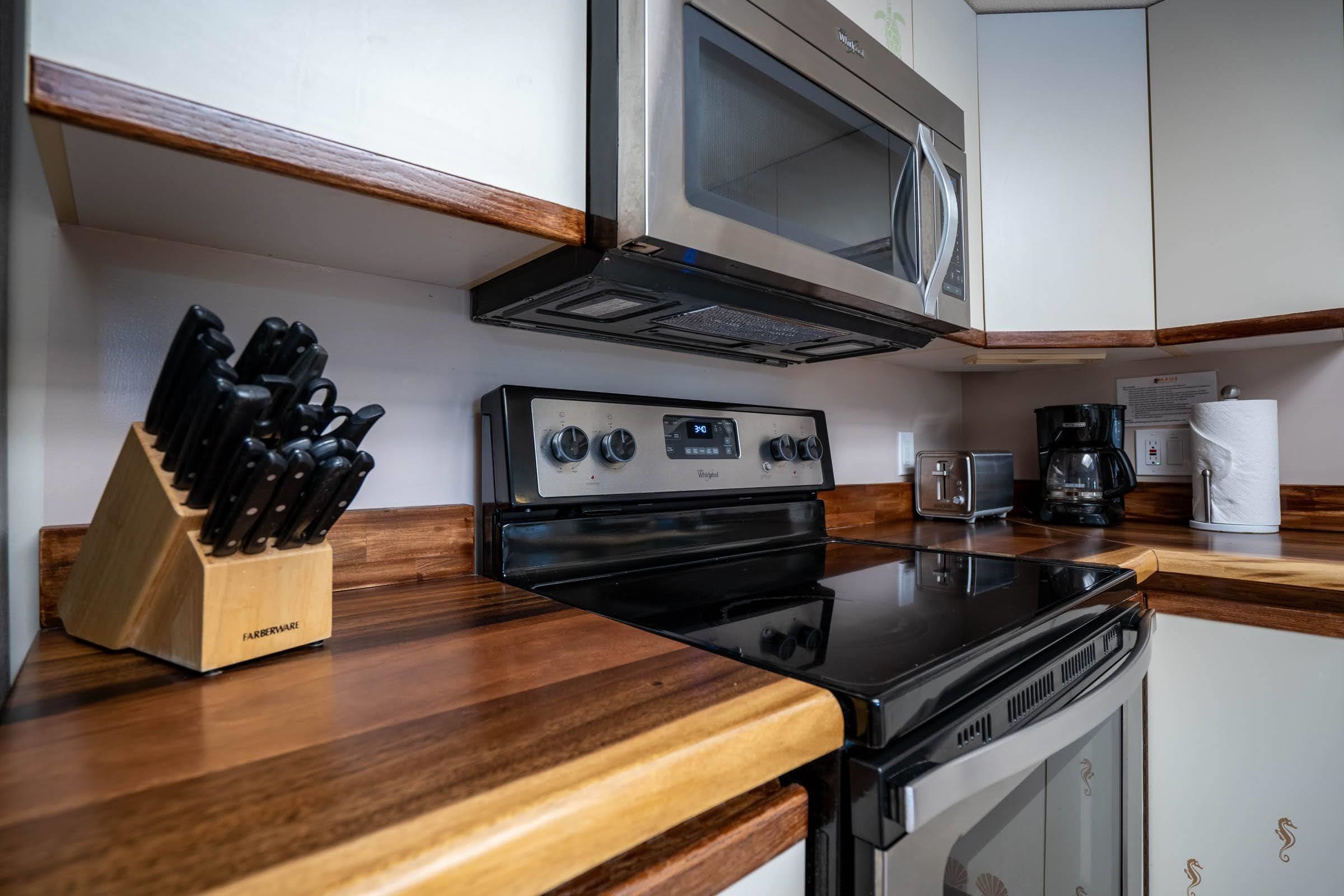2575 South Kihei Road, Unit G209 Kihei, HI 96753 - Photo 7 of 27 a kitchen with a stove and a microwave