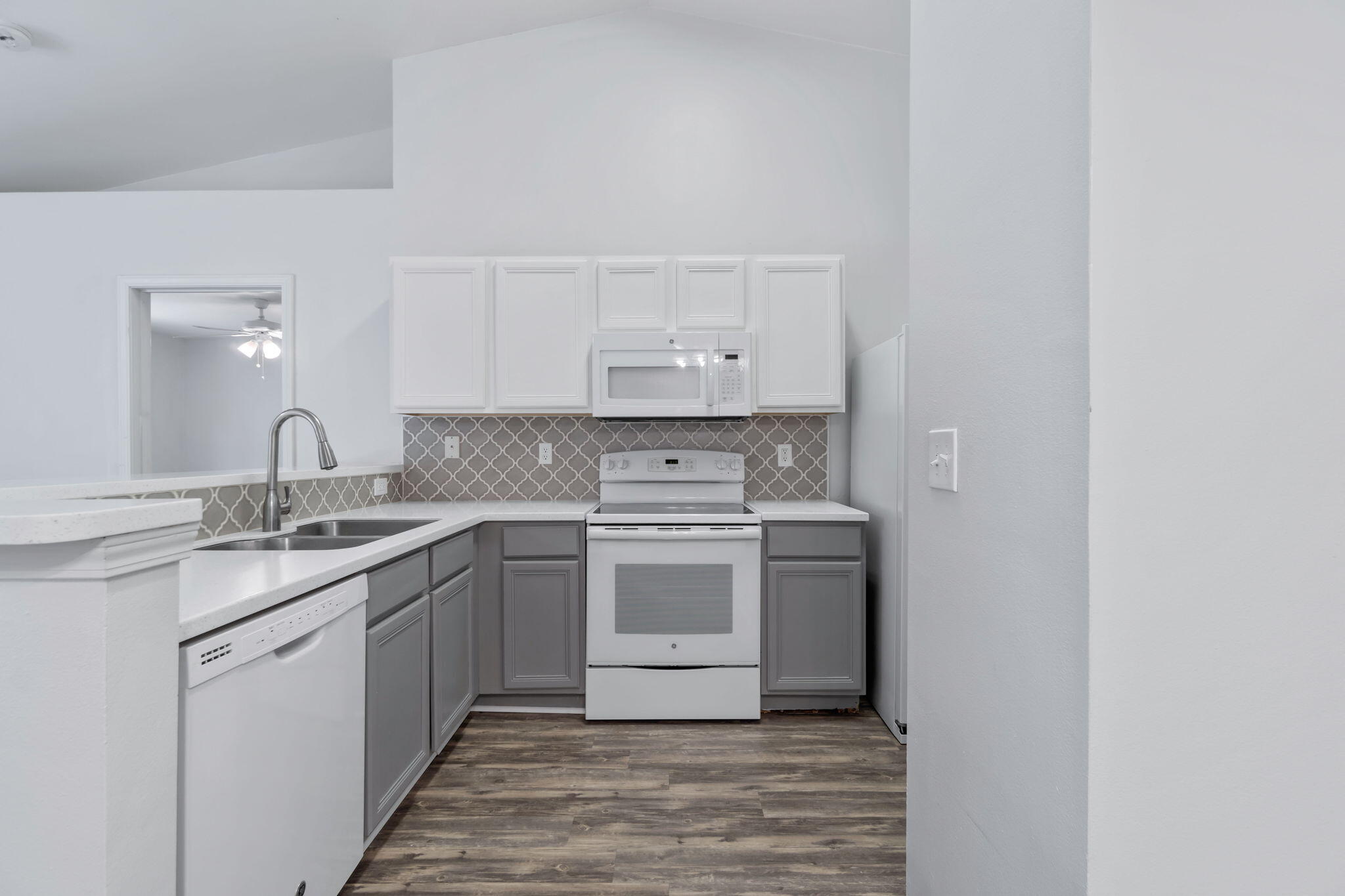 218 Cabana Way Crestview, FL 32536 - Photo 11 of 35 a kitchen with stainless steel appliances granite countertop a stove and white cabinets
