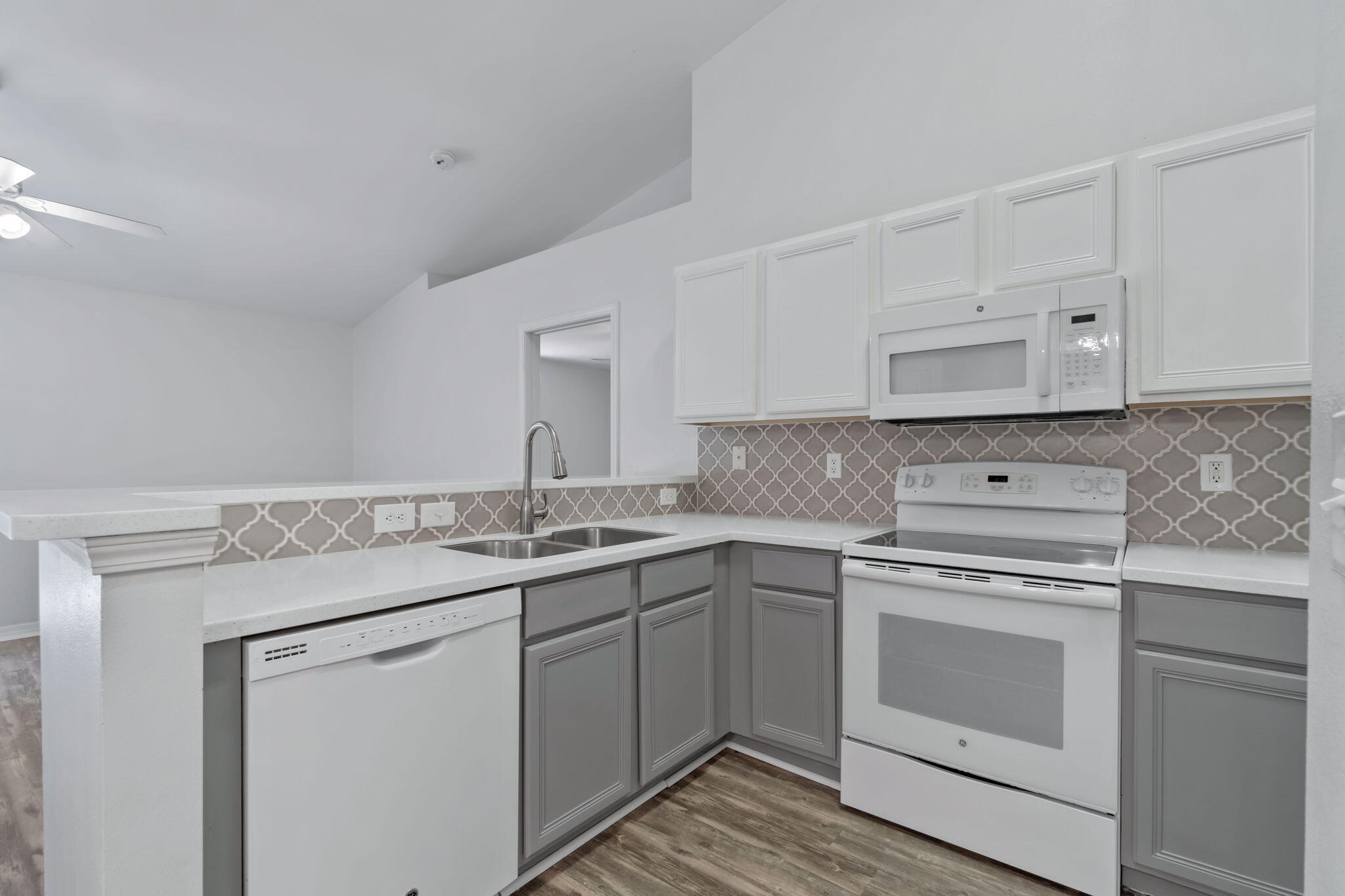 218 Cabana Way Crestview, FL 32536 - Photo 12 of 35 a kitchen with a stove sink and cabinets