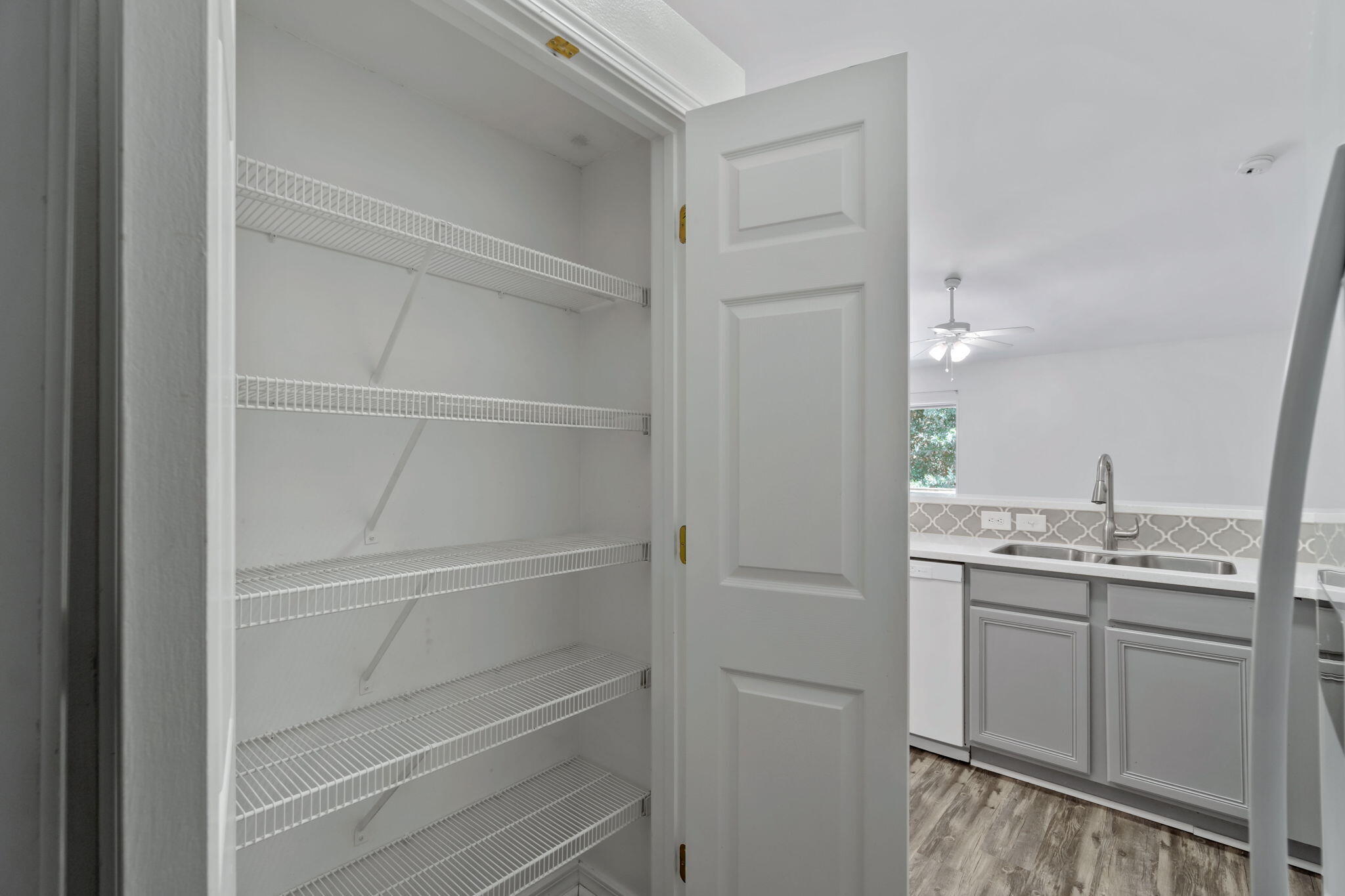 218 Cabana Way Crestview, FL 32536 - Photo 14 of 35 a view of walk in closet with empty racks