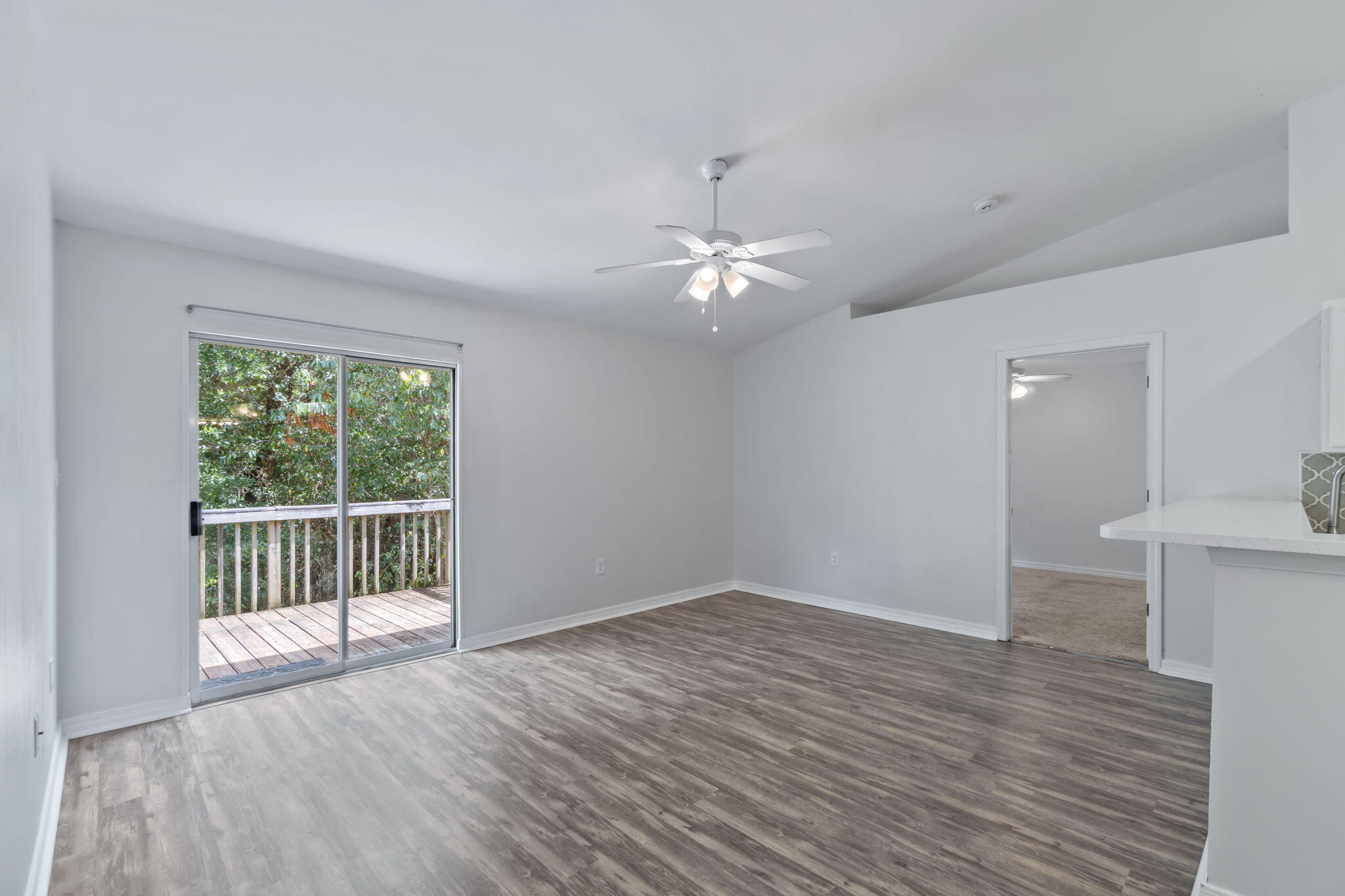 218 Cabana Way Crestview, FL 32536 - Photo 15 of 35 a view of an empty room with wooden floor and a window