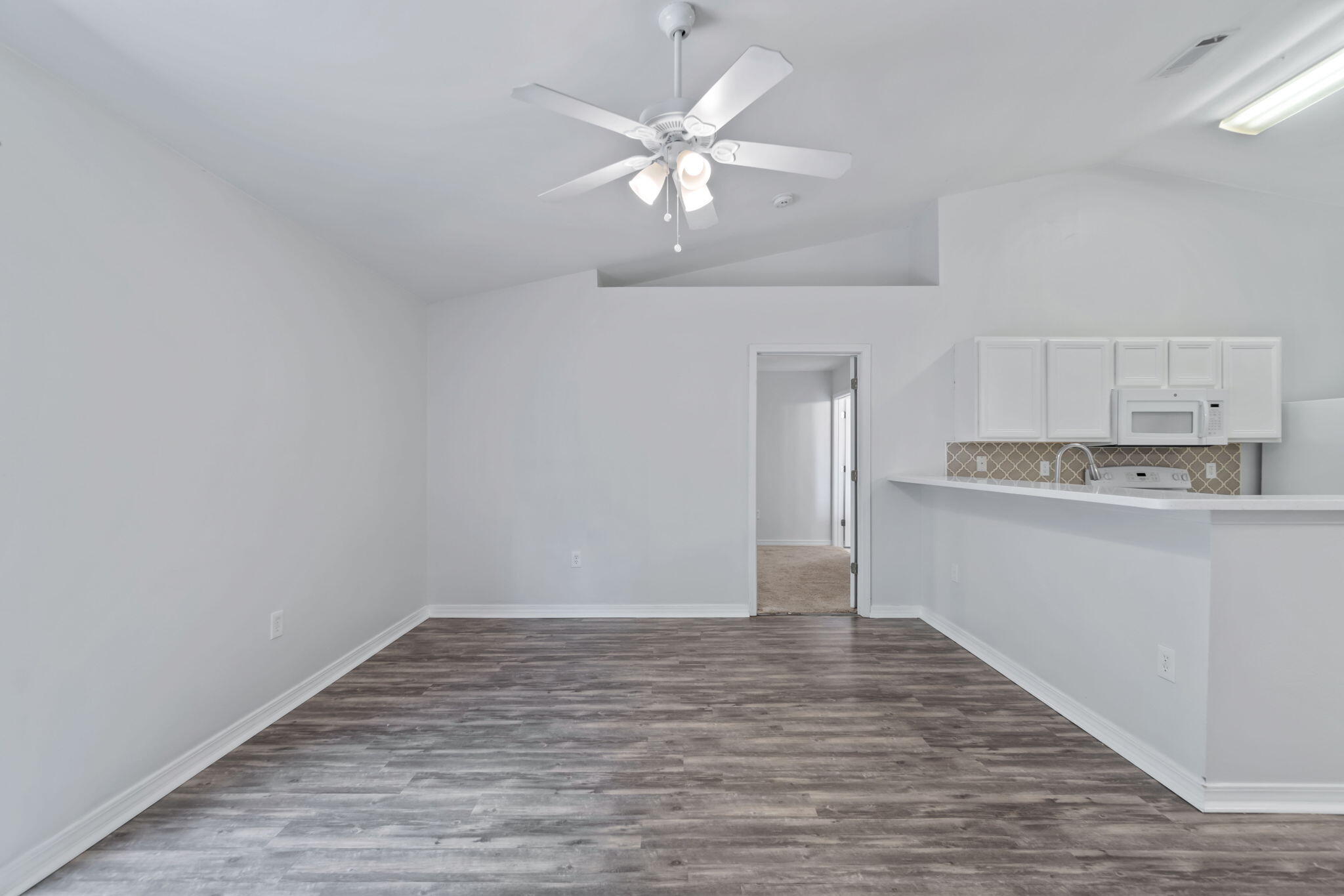 218 Cabana Way Crestview, FL 32536 - Photo 16 of 35 a view of an empty room and wooden floor