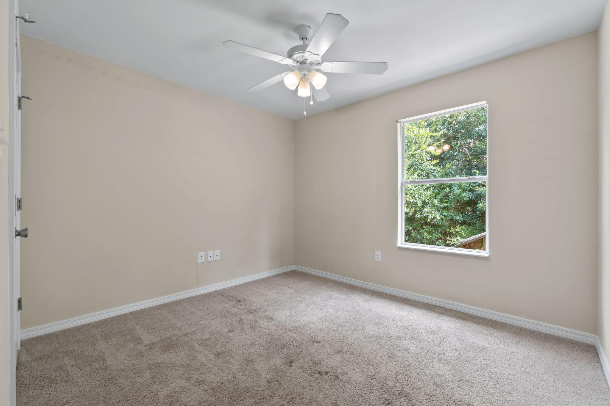218 Cabana Way Crestview, FL 32536 - Photo 17 of 35 an empty room with a window and a ceiling fan