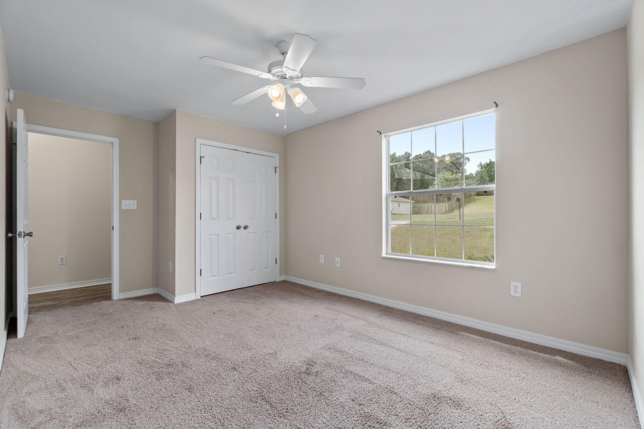 218 Cabana Way Crestview, FL 32536 - Photo 23 of 35 an empty room with windows and fan