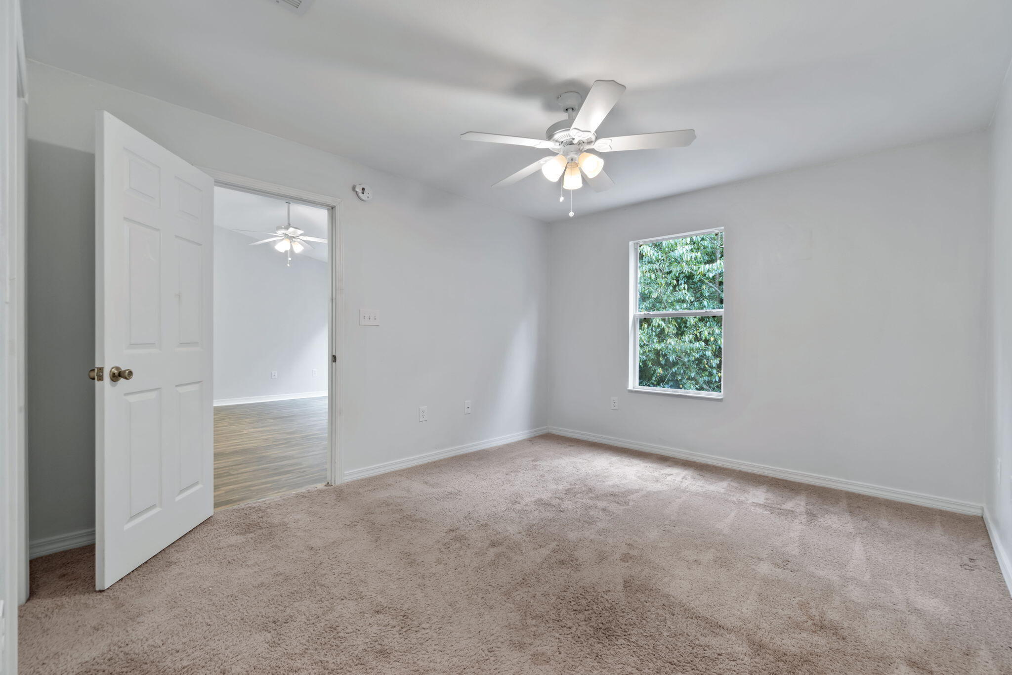 218 Cabana Way Crestview, FL 32536 - Photo 24 of 35 an empty room with windows and fan