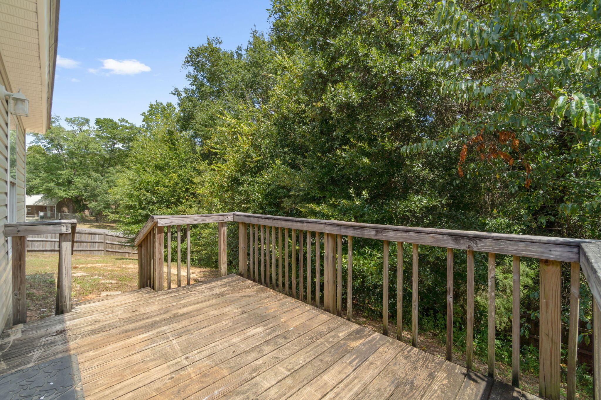 218 Cabana Way Crestview, FL 32536 - Photo 29 of 35 a balcony with wooden floor and fence