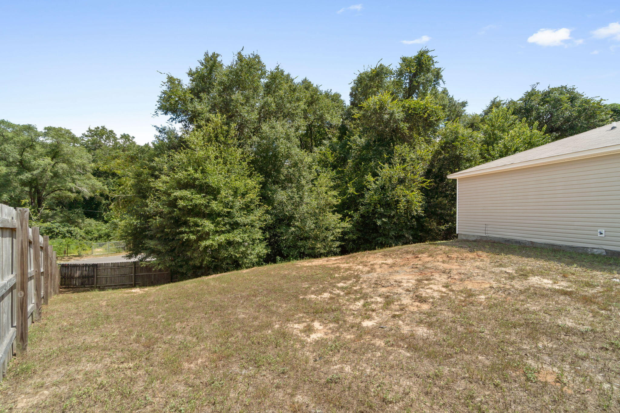 218 Cabana Way Crestview, FL 32536 - Photo 30 of 35 a backyard of a house with lots of green space