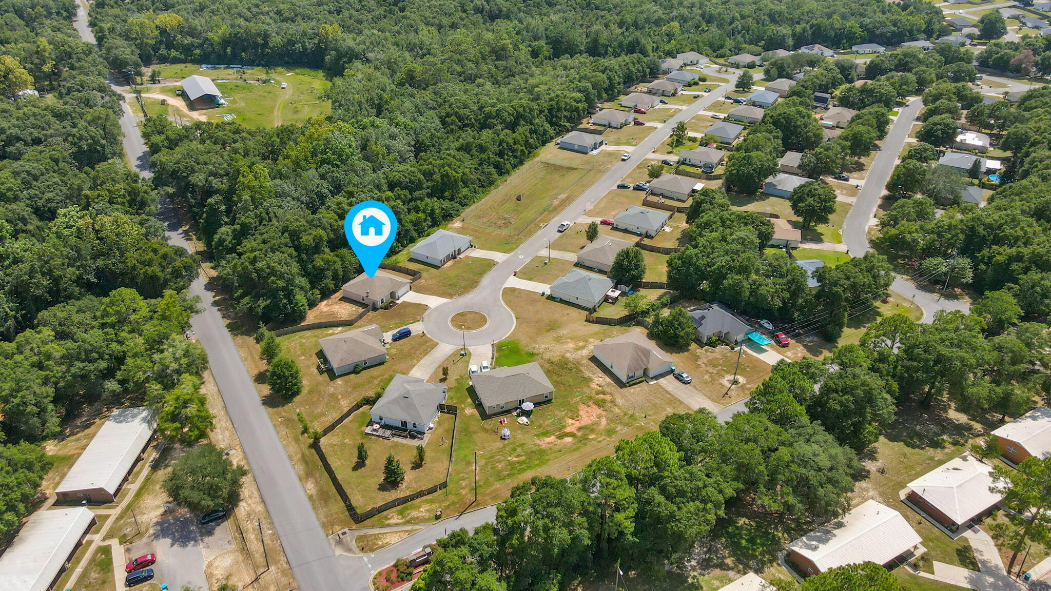 218 Cabana Way Crestview, FL 32536 - Photo 32 of 35 an aerial view of a house with a yard and garden
