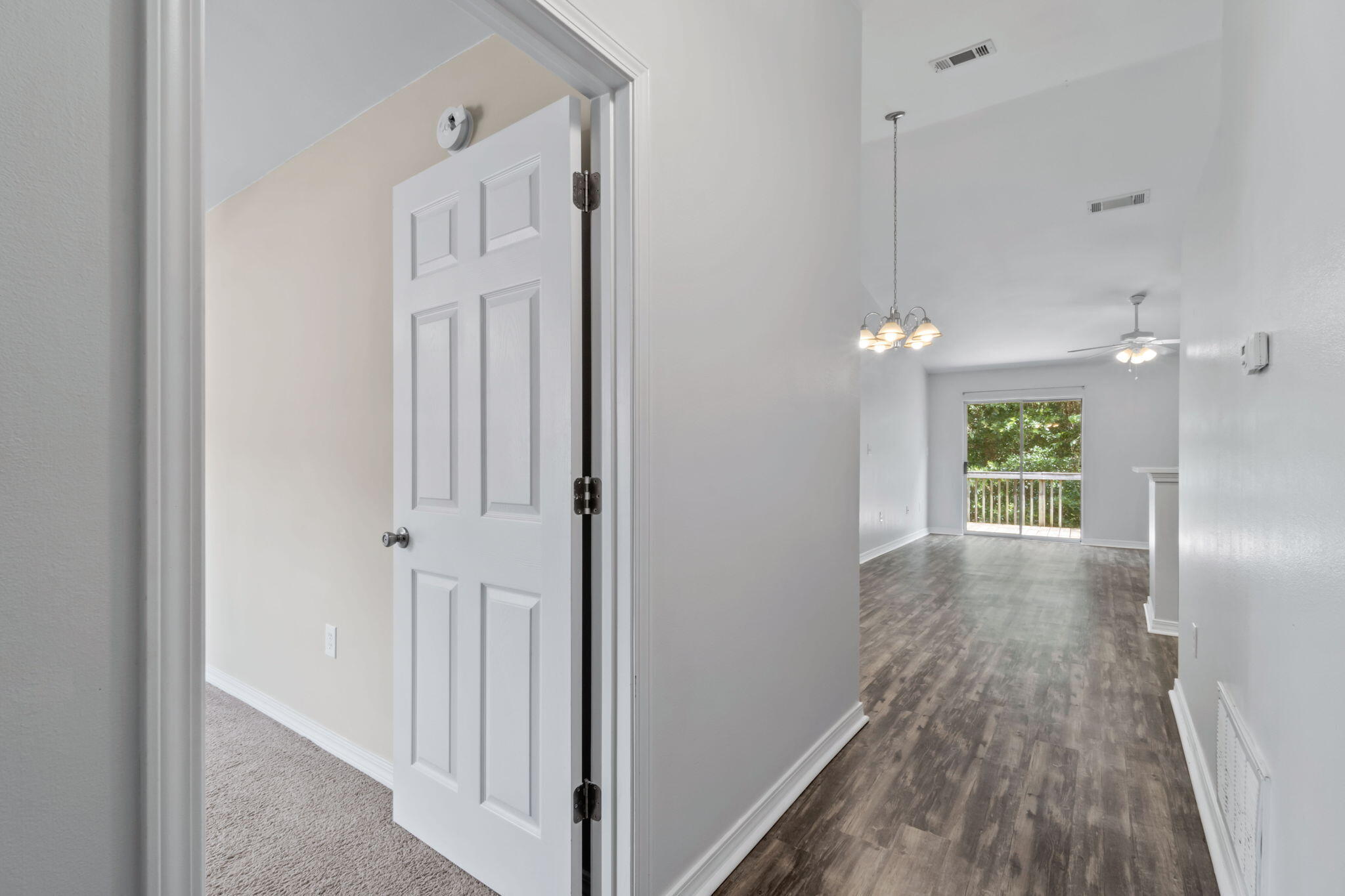 218 Cabana Way Crestview, FL 32536 - Photo 6 of 35 a view of a hallway with wooden floor and closet