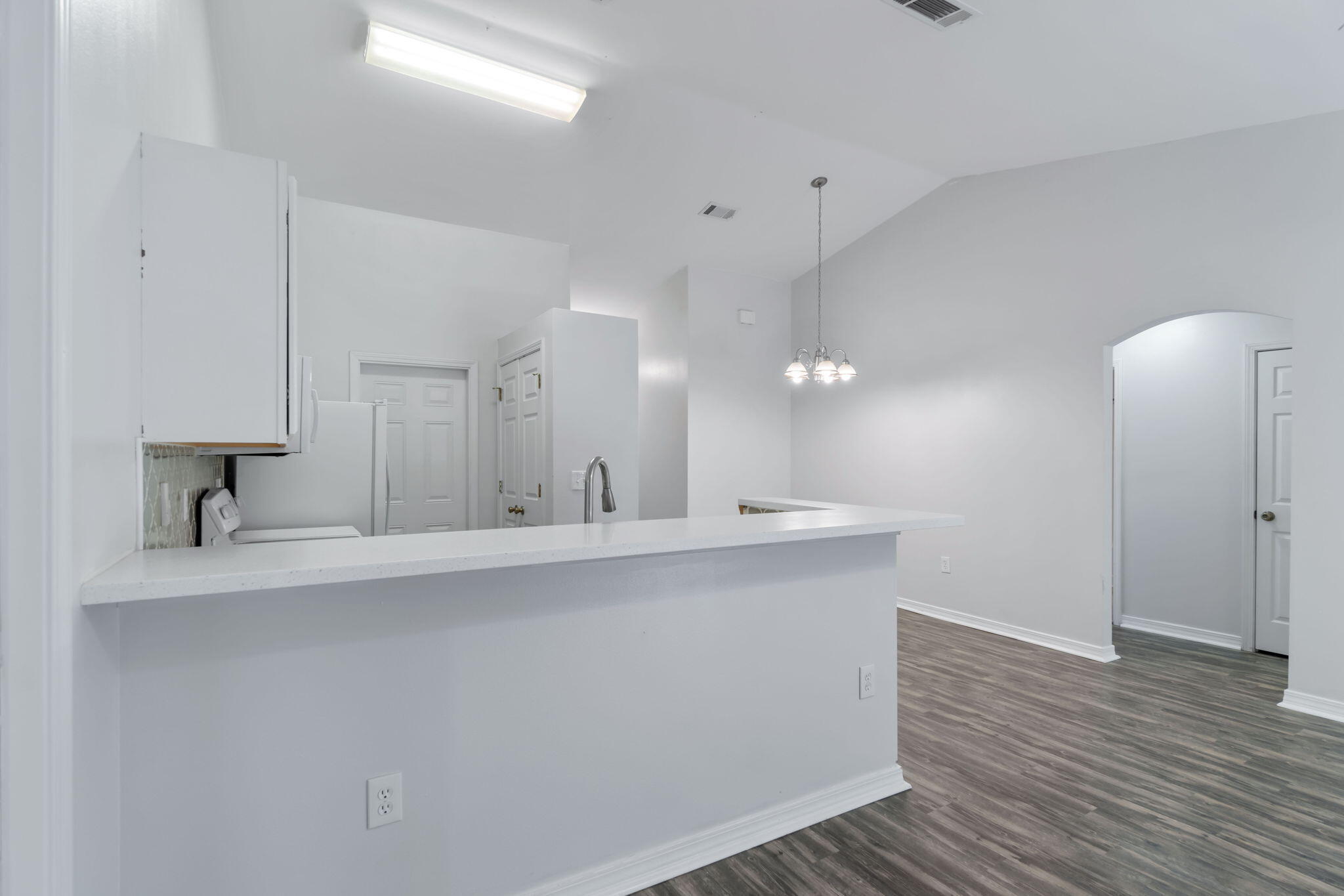 218 Cabana Way Crestview, FL 32536 - Photo 8 of 35 a view of a kitchen with kitchen island a sink stainless steel appliances and cabinets