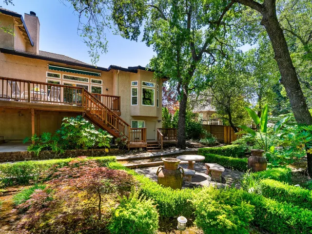 a swimming pool with outdoor seating and yard