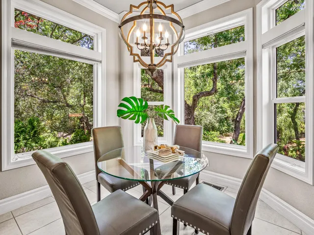a view of a dining room with furniture window and outside view