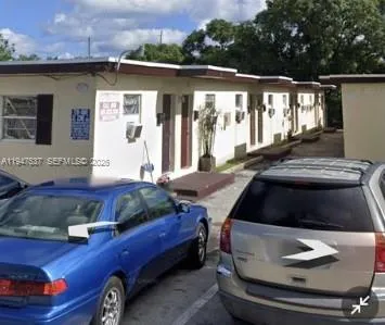 a car parked in front of a house