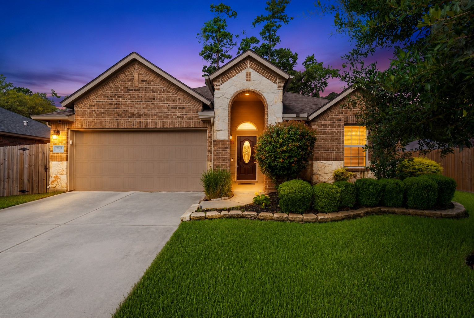 7611 Willow School Drive Spring, TX 77389 - Photo 1 of 23 a front view of a house with a garden and plants