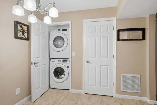 a view of a hallway with washer and dryer