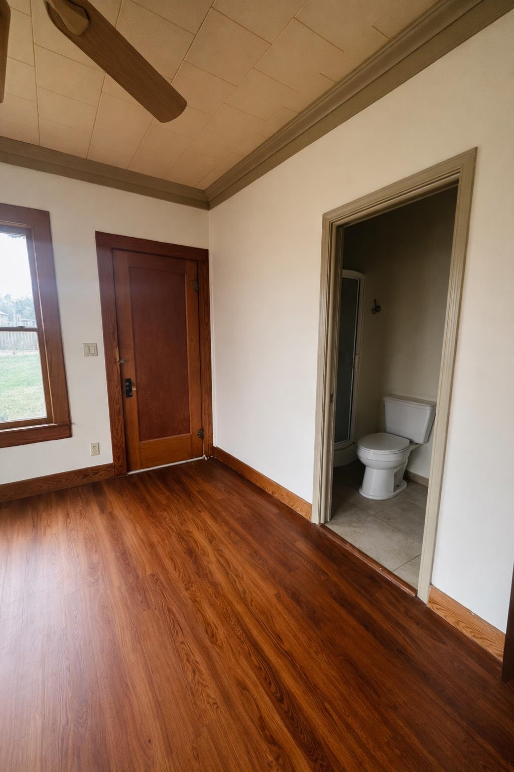 206 East Sandstone Street Llano, TX 78643 - Photo 11 of 16 a view of an empty room and wooden floor