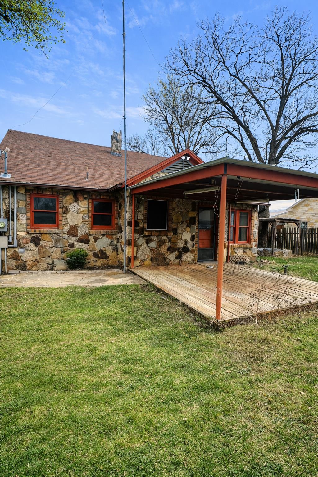 206 East Sandstone Street Llano, TX 78643 - Photo 16 of 16 a backyard of a house with yard table and chairs
