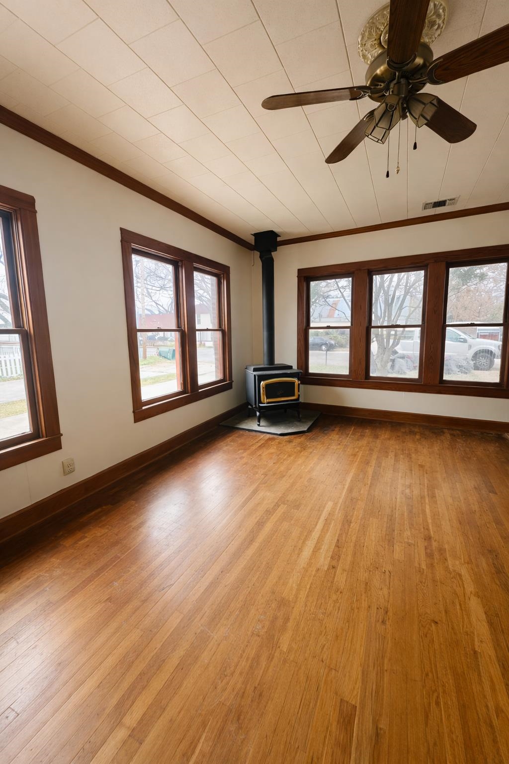 206 East Sandstone Street Llano, TX 78643 - Photo 5 of 16 a view of empty room with wooden floor and fan