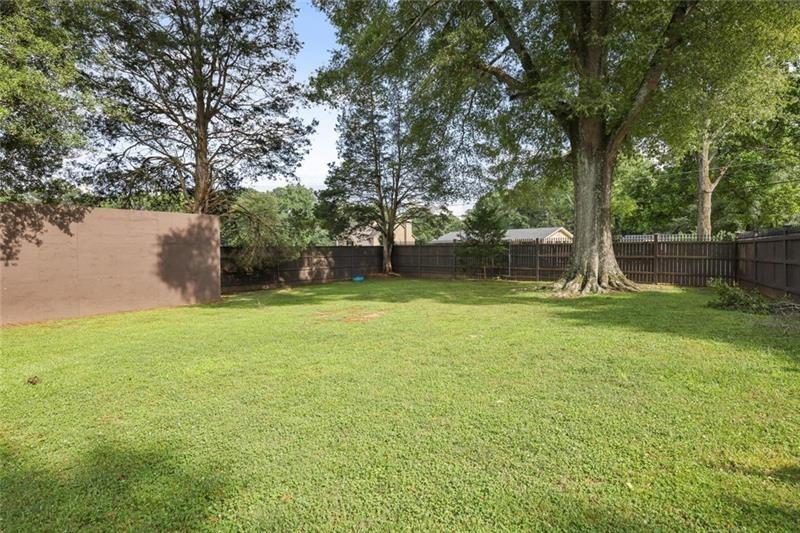 1665 Cunningham Road Southwest Marietta, GA 30008 - Photo 21 of 36 a view of a garden with a slide
