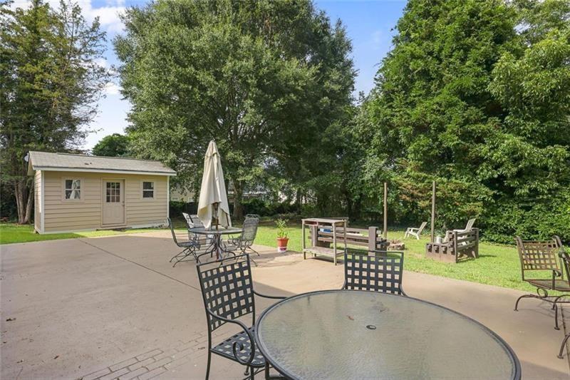 1665 Cunningham Road Southwest Marietta, GA 30008 - Photo 23 of 36 a view of a patio with a table and chairs