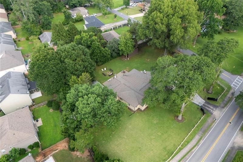 1665 Cunningham Road Southwest Marietta, GA 30008 - Photo 27 of 36 an aerial view of residential house with outdoor space and trees all around