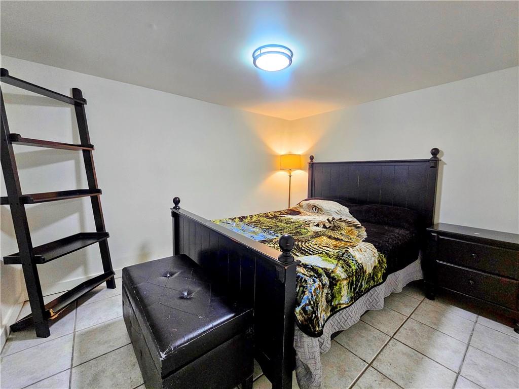 1665 Cunningham Road Southwest Marietta, GA 30008 - Photo 30 of 36 a bedroom with a bed and a window