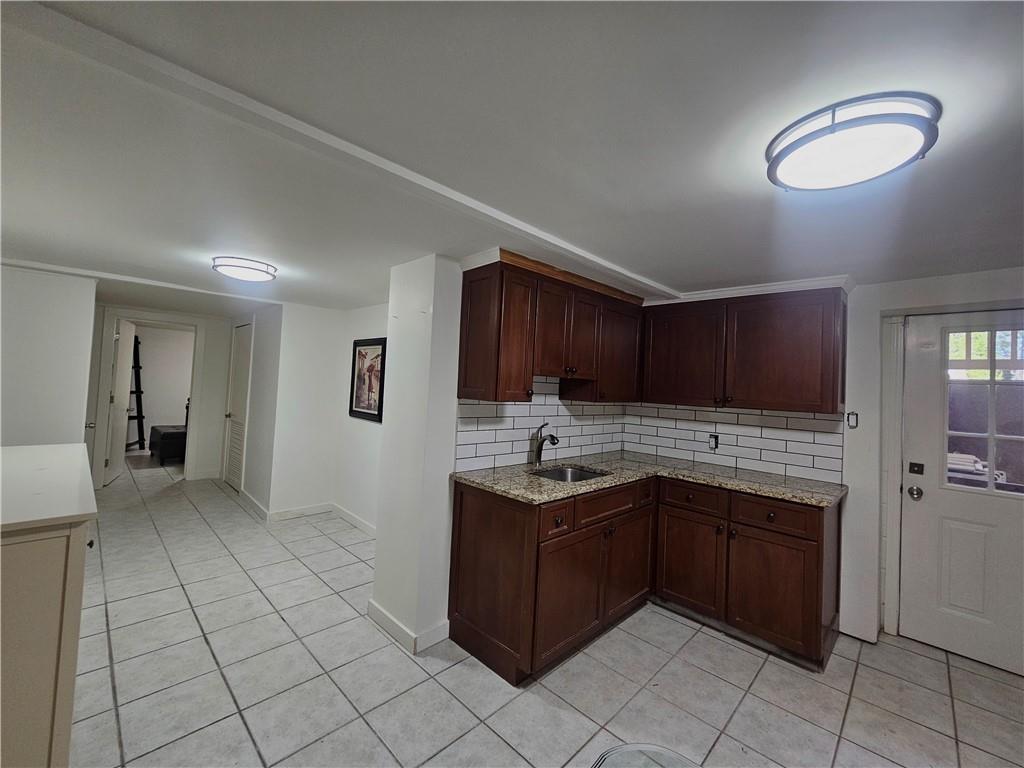 1665 Cunningham Road Southwest Marietta, GA 30008 - Photo 34 of 36 a kitchen with a sink and cabinets