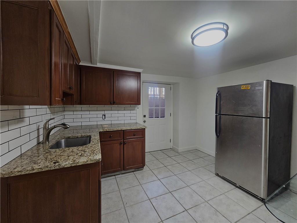 1665 Cunningham Road Southwest Marietta, GA 30008 - Photo 35 of 36 a kitchen with a refrigerator sink and cabinets