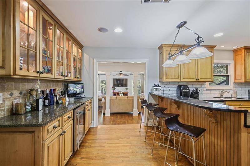 1665 Cunningham Road Southwest Marietta, GA 30008 - Photo 7 of 36 a kitchen with stainless steel appliances a sink and cabinets