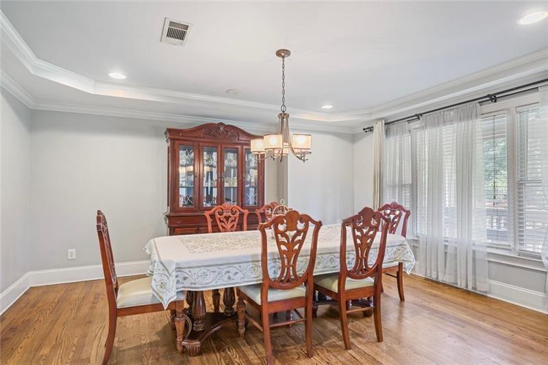 1665 Cunningham Road Southwest Marietta, GA 30008 - Photo 8 of 36 a view of a dining room with furniture window and wooden floor