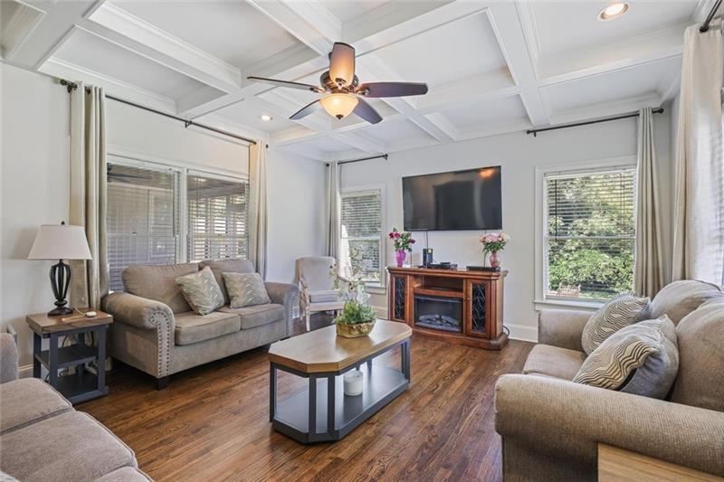 1665 Cunningham Road Southwest Marietta, GA 30008 - Photo 9 of 36 a living room with fireplace furniture and a flat screen tv