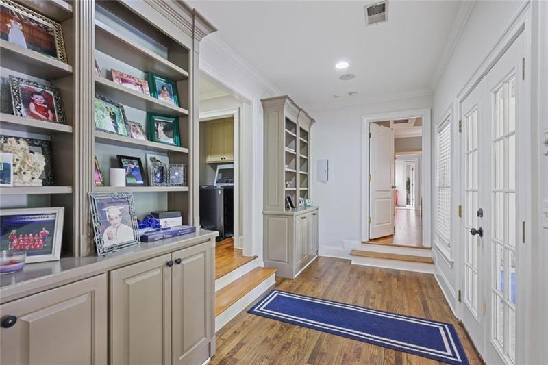 1665 Cunningham Road Southwest Marietta, GA 30008 - Photo 10 of 36 a living room with furniture and a book shelf