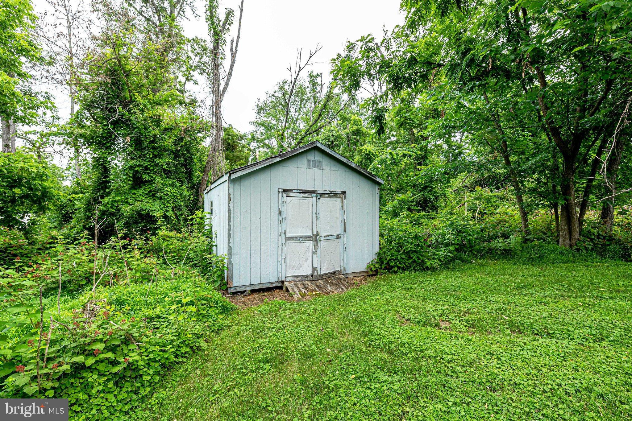 17890 Dry Mill Road Leesburg, VA 20175 - Photo 23 of 73 A shed is tucked away to hold yard equipment