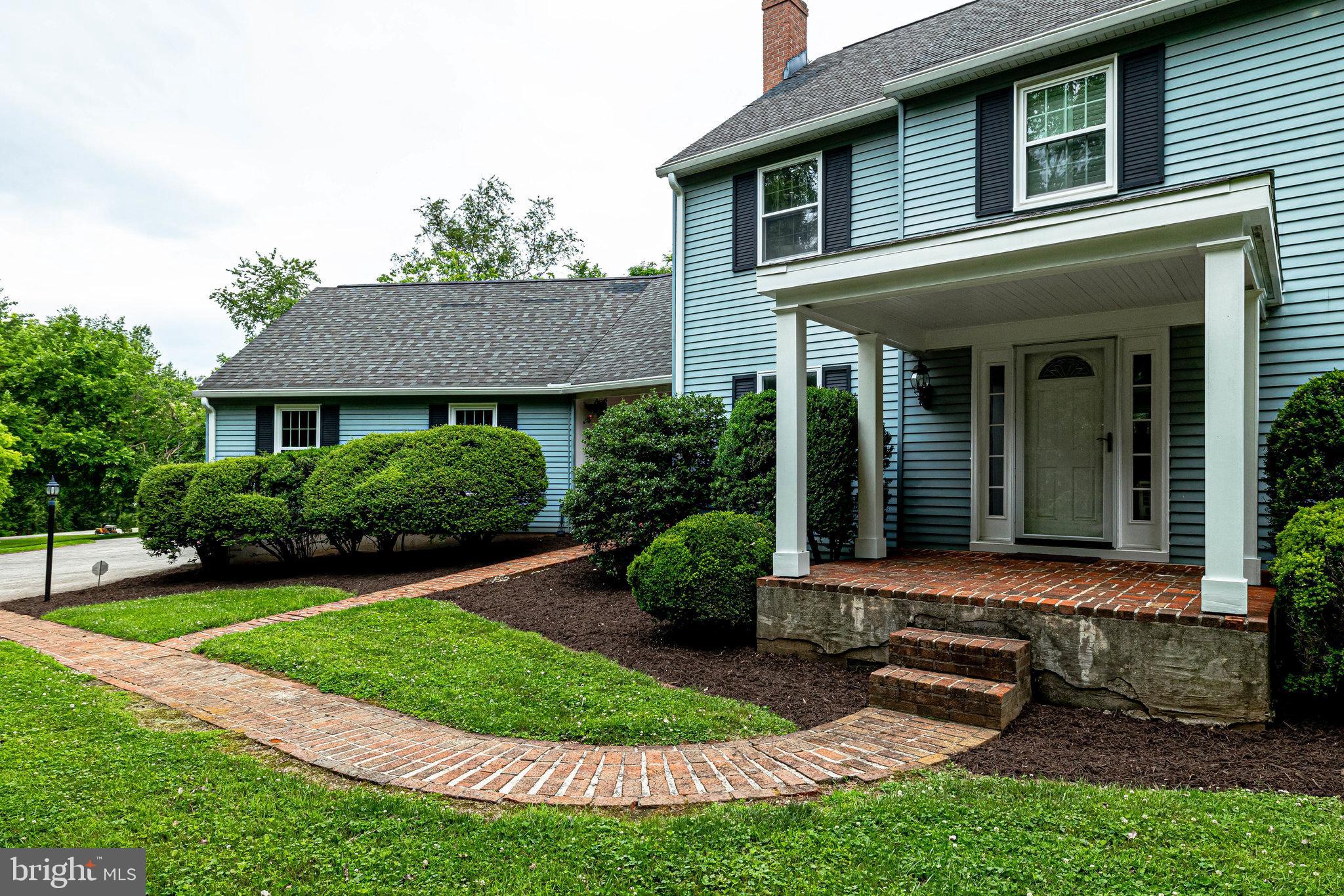 The pathway leads to the front door & breezeway