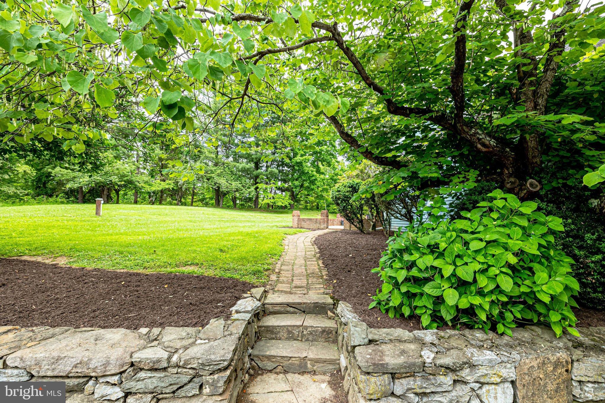 17890 Dry Mill Road Leesburg, VA 20175 - Photo 10 of 73 The stonework adds a special touch to the yard