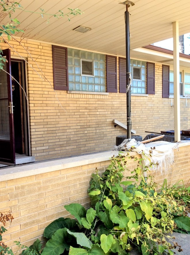 Undisclosed Address North Riverside, IL 60546 - Photo 2 of 12 a front view of a house with a yard